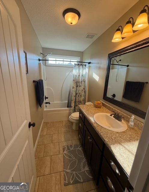4961 Bentwood Ct, Valdosta, GA 31601 - full bathroom with shower / bath combo, vanity, toilet, and tile patterned floors