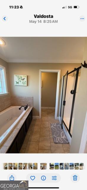 4961 Bentwood Ct, Valdosta, GA 31601 - full bathroom with a garden tub, tile patterned floors, a shower stall, and baseboards