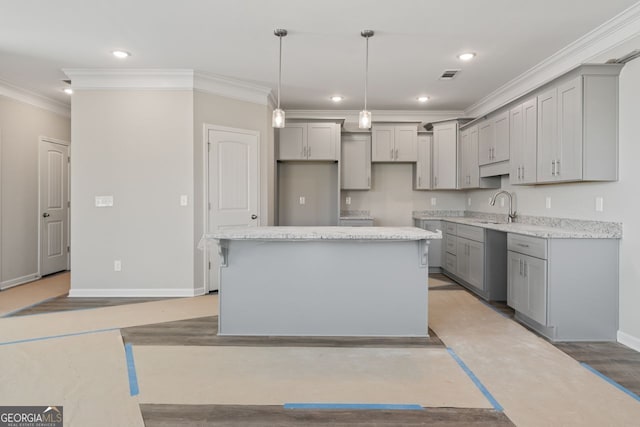 2721 Fareed St, Douglasville, GA 30135 - kitchen featuring gray cabinetry, a sink, crown molding, a center island, and baseboards