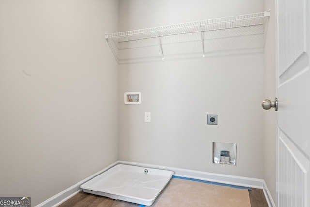 2721 Fareed St, Douglasville, GA 30135 - washroom with baseboards, hookup for a washing machine, hookup for an electric dryer, and wood finished floors