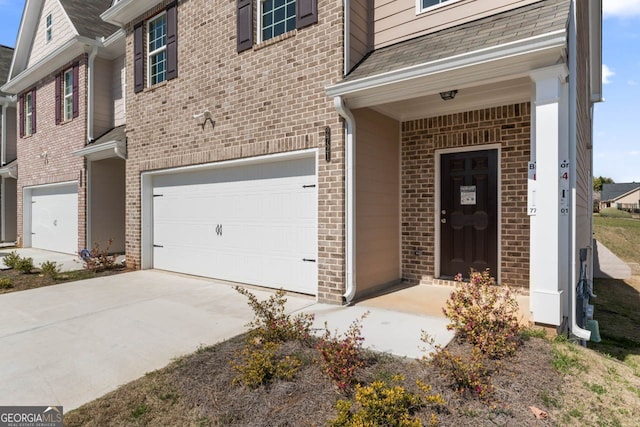 2721 Fareed St, Douglasville, GA 30135 - entrance to property featuring brick siding, a garage, and concrete driveway