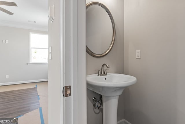 2721 Fareed St, Douglasville, GA 30135 - bathroom with crown molding, a ceiling fan, and baseboards