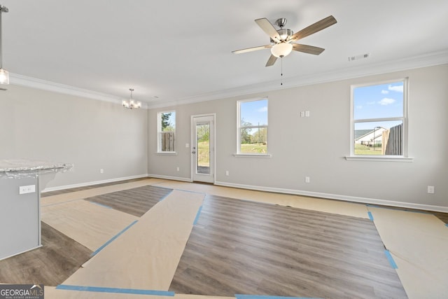 2721 Fareed St, Douglasville, GA 30135 - unfurnished living room with crown molding, a chandelier, wood finished floors, ceiling fan, and baseboards