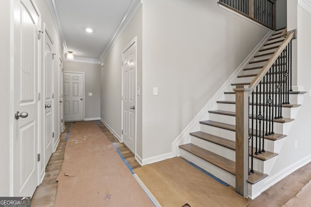 2811 Fareed, Douglasville, GA 30135 - stairway with crown molding, baseboards, wood finished floors, and recessed lighting