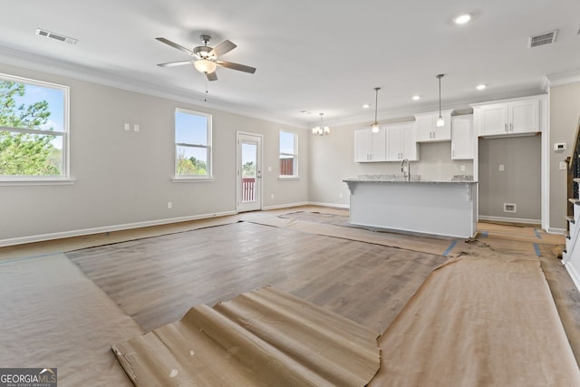 2811 Fareed, Douglasville, GA 30135 - unfurnished living room with ornamental molding, a ceiling fan, a sink, baseboards, and recessed lighting