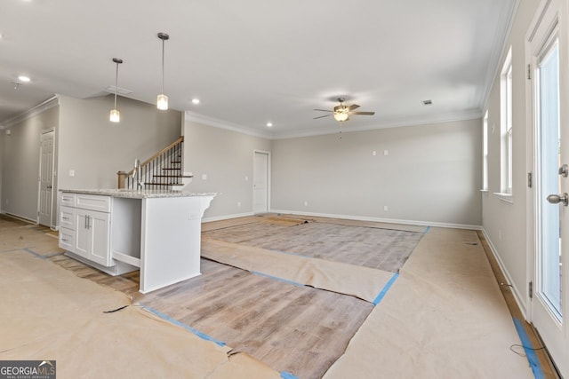 2811 Fareed, Douglasville, GA 30135 - unfurnished living room featuring ceiling fan, crown molding, baseboards, recessed lighting, and stairway