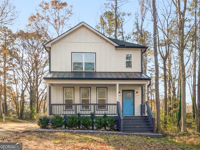 741 SE Knox Dr SE, Atlanta, GA 30315 - view of front of house featuring a standing seam roof, covered porch, metal roof, and board and batten siding