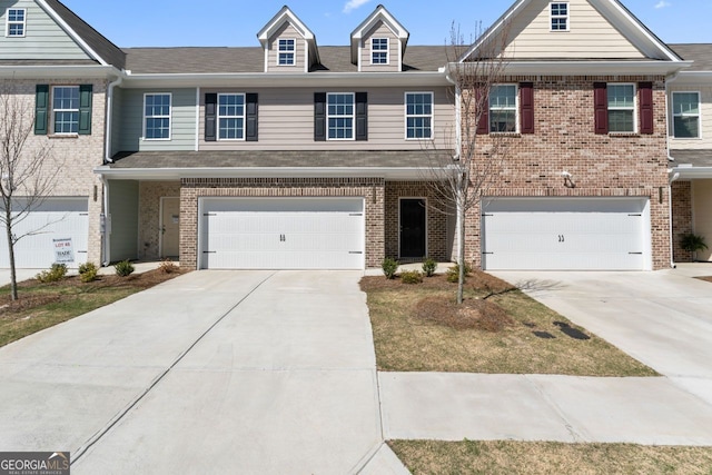 2821 Fareed, Douglasville, GA 30135 - townhome / multi-family property with a garage, driveway, and brick siding