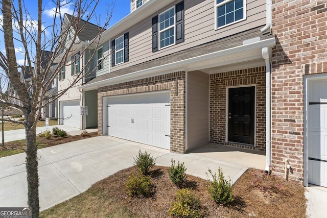 2821 Fareed, Douglasville, GA 30135 - entrance to property featuring brick siding, a garage, and concrete driveway