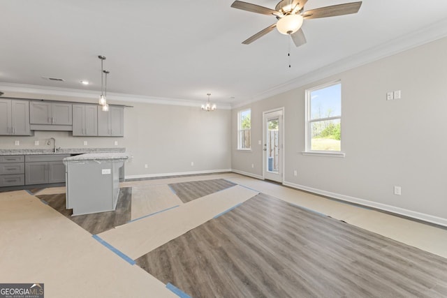 2821 Fareed, Douglasville, GA 30135 - kitchen with gray cabinets, a sink, ornamental molding, light countertops, and light wood finished floors