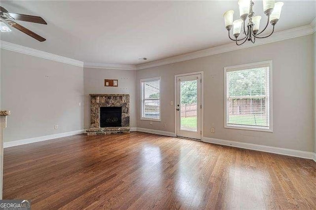 2500 Morgan Chase Dr, Buford, GA 30519 - unfurnished living room with a chandelier, wood finished floors, a fireplace, crown molding, and a ceiling fan