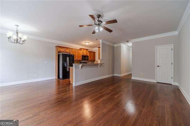 2500 Morgan Chase Dr, Buford, GA 30519 - unfurnished living room with ornamental molding, a chandelier, ceiling fan, and wood finished floors