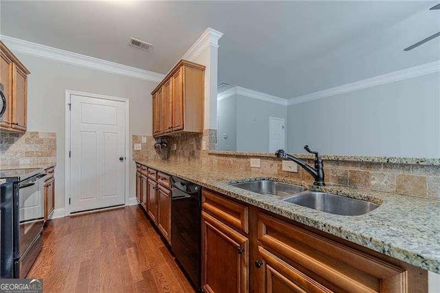 2500 Morgan Chase Dr, Buford, GA 30519 - kitchen featuring black appliances, a sink, dark wood finished floors, light stone countertops, and ornamental molding