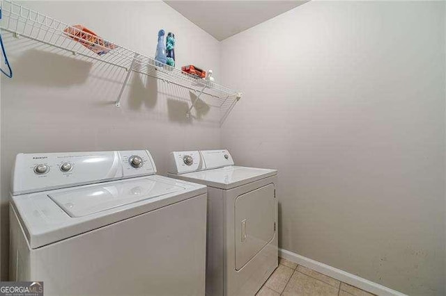 2500 Morgan Chase Dr, Buford, GA 30519 - laundry room featuring washer and clothes dryer and light tile patterned flooring