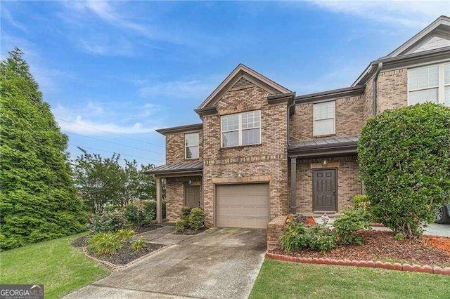 2500 Morgan Chase Dr, Buford, GA 30519 - view of front of house with brick siding, a standing seam roof, a garage, and driveway