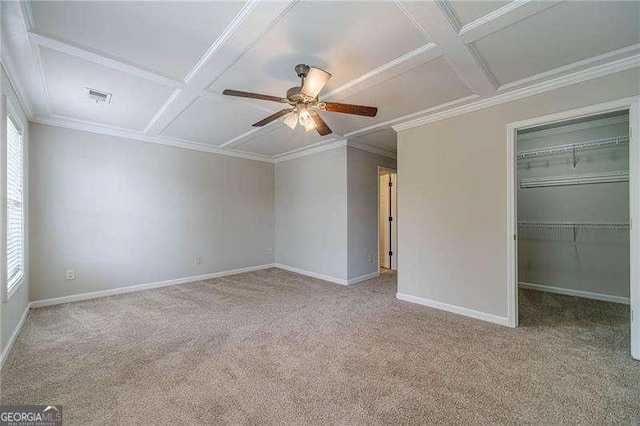 2500 Morgan Chase Dr, Buford, GA 30519 - unfurnished bedroom with coffered ceiling, carpet, multiple windows, a walk in closet, and crown molding