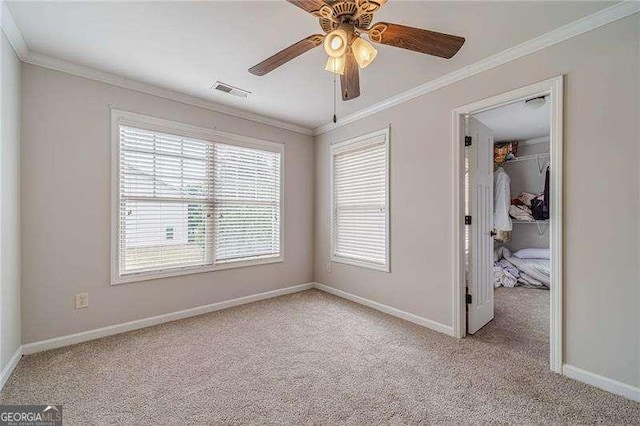 2500 Morgan Chase Dr, Buford, GA 30519 - unfurnished bedroom featuring light carpet, a spacious closet, multiple windows, and crown molding