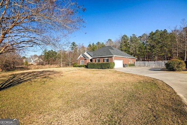 2977 William Few Pkwy, Evans, GA 30809 - view of front facade with driveway, a garage, and brick siding