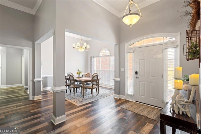 2977 William Few Pkwy, Evans, GA 30809 - entryway with dark wood-type flooring, baseboards, crown molding, decorative columns, and a high ceiling