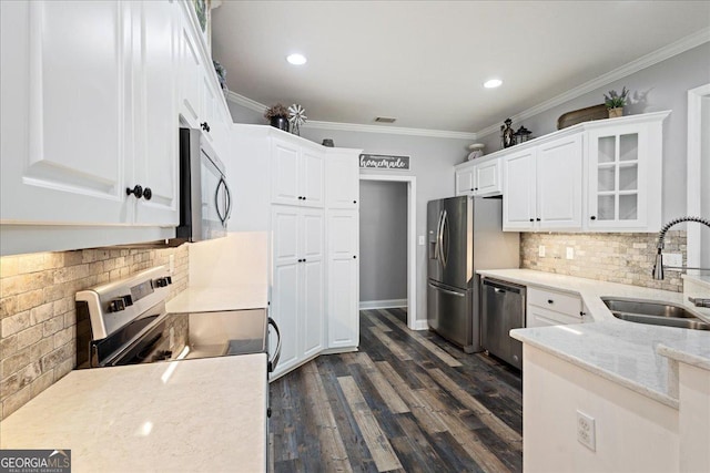 2977 William Few Pkwy, Evans, GA 30809 - kitchen featuring stainless steel appliances, a sink, white cabinetry, decorative backsplash, and dark wood-type flooring