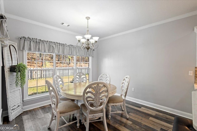 2977 William Few Pkwy, Evans, GA 30809 - dining room with a chandelier, baseboards, wood finished floors, and ornamental molding