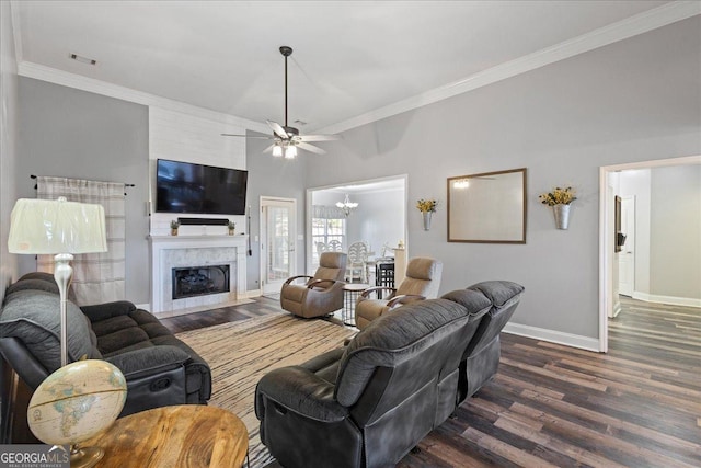 2977 William Few Pkwy, Evans, GA 30809 - living area with baseboards, wood finished floors, crown molding, a ceiling fan, and a chandelier