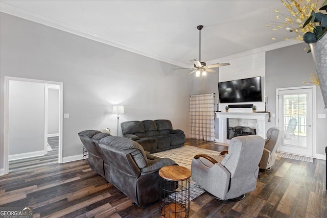 2977 William Few Pkwy, Evans, GA 30809 - living area with dark wood-style flooring, ornamental molding, a fireplace, a ceiling fan, and baseboards