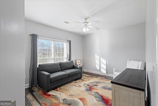 2977 William Few Pkwy, Evans, GA 30809 - living area featuring wood finished floors, ceiling fan, and baseboards