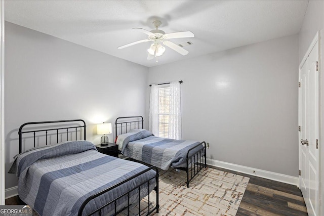 2977 William Few Pkwy, Evans, GA 30809 - bedroom featuring baseboards, wood finished floors, and a ceiling fan