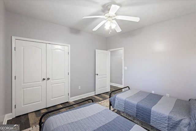2977 William Few Pkwy, Evans, GA 30809 - bedroom featuring wood finished floors, a closet, baseboards, and a ceiling fan