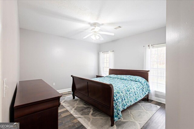 2977 William Few Pkwy, Evans, GA 30809 - bedroom with dark wood finished floors, baseboards, and ceiling fan