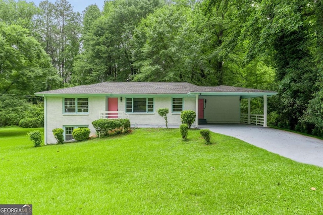 2343 Dawn Dr, Decatur, GA 30032 - view of front of house with concrete driveway, a front lawn, and a carport
