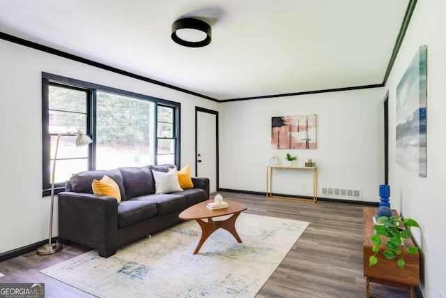 2343 Dawn Dr, Decatur, GA 30032 - living room featuring ornamental molding, baseboards, and wood finished floors