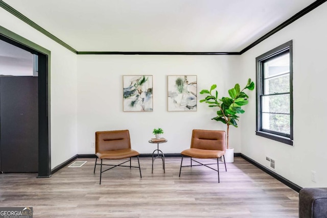2343 Dawn Dr, Decatur, GA 30032 - sitting room with ornamental molding, wood finished floors, and baseboards