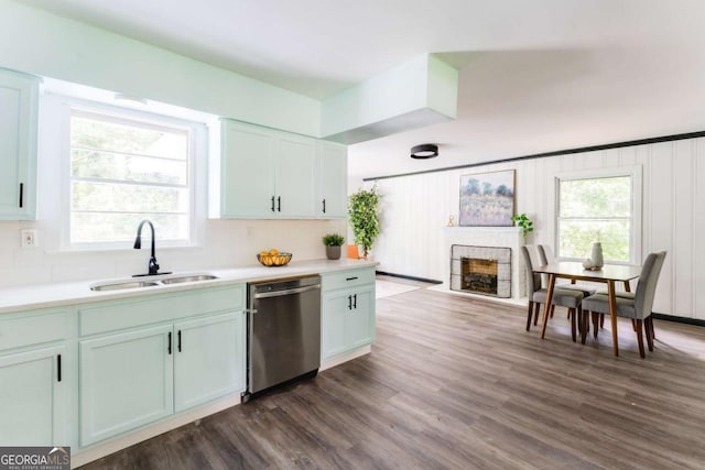 2343 Dawn Dr, Decatur, GA 30032 - kitchen featuring dishwasher, a sink, light countertops, and a fireplace