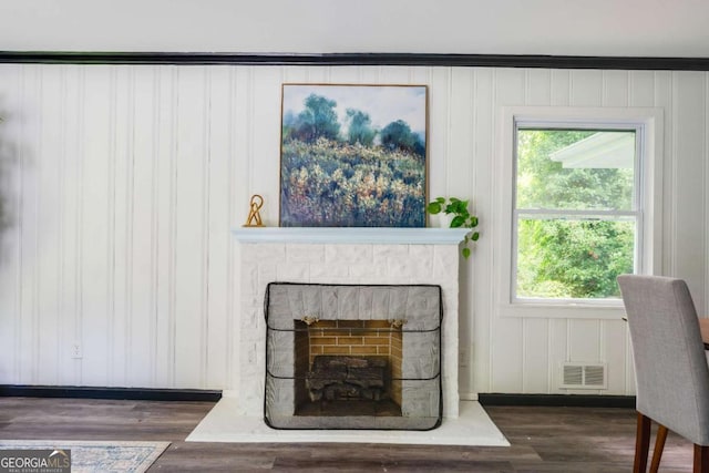 2343 Dawn Dr, Decatur, GA 30032 - living room featuring wood finished floors and a fireplace with raised hearth