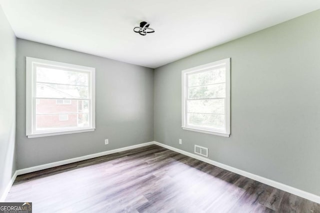 2343 Dawn Dr, Decatur, GA 30032 - empty room featuring healthy amount of natural light, wood finished floors, and baseboards