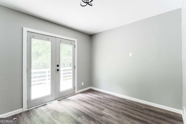 2343 Dawn Dr, Decatur, GA 30032 - doorway featuring french doors, wood finished floors, and baseboards