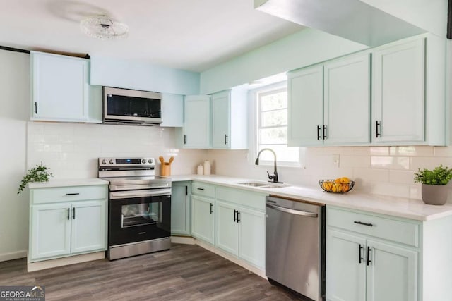 2343 Dawn Dr, Decatur, GA 30032 - kitchen featuring appliances with stainless steel finishes, a sink, light countertops, and decorative backsplash