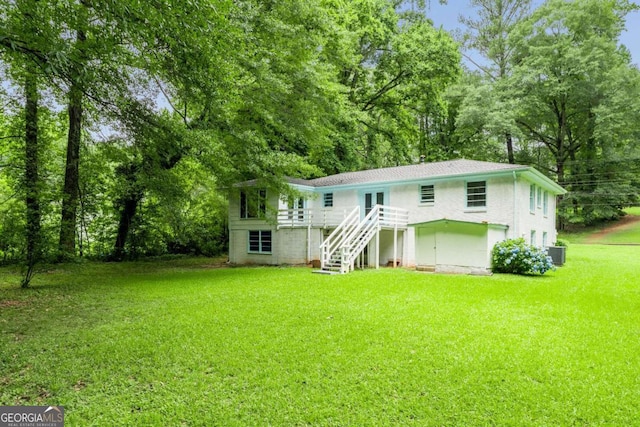 2343 Dawn Dr, Decatur, GA 30032 - rear view of house featuring stairs, a lawn, a wooden deck, central air condition unit, and view of scattered trees