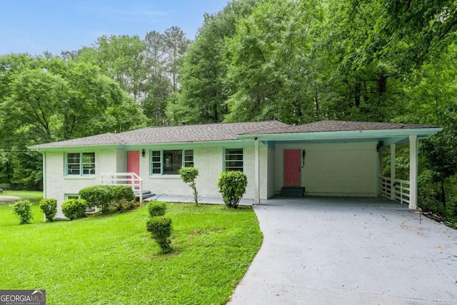 2343 Dawn Dr, Decatur, GA 30032 - single story home featuring concrete driveway, a front lawn, an attached carport, and view of wooded area
