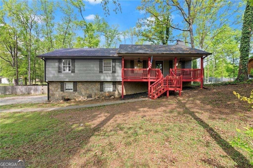 230 Oakridge Dr SE, Cartersville, GA 30121 - view of front facade featuring a porch, stairway, and a chimney