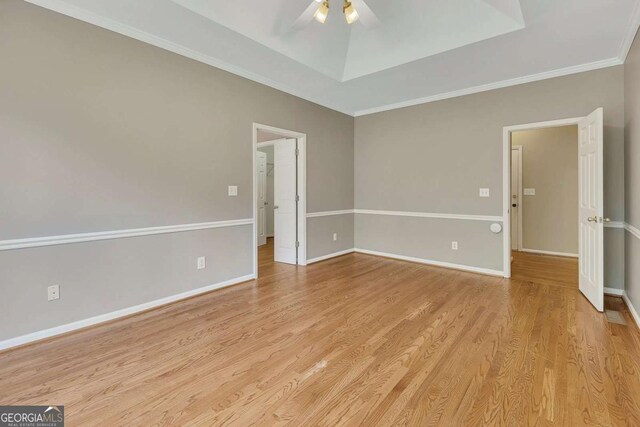 4815 Rapids Cir NW, Acworth, GA 30102 - unfurnished room with ceiling fan, light wood-style floors, a raised ceiling, and ornamental molding