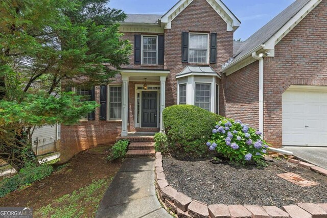 4815 Rapids Cir NW, Acworth, GA 30102 - view of front facade featuring brick siding and an attached garage