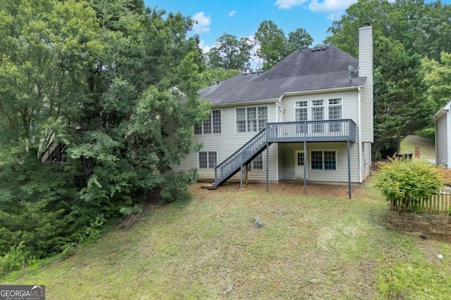 4815 Rapids Cir NW, Acworth, GA 30102 - back of property with stairway, a deck, a yard, and a chimney