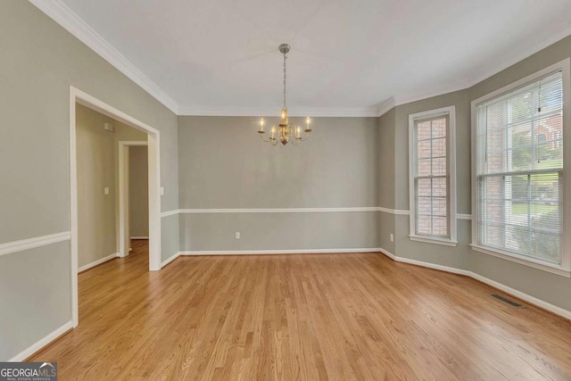 4815 Rapids Cir NW, Acworth, GA 30102 - unfurnished room featuring a chandelier, light wood-style floors, and crown molding
