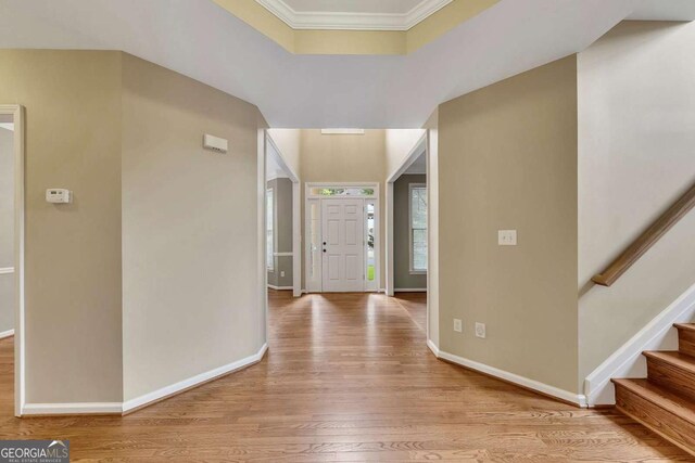 4815 Rapids Cir NW, Acworth, GA 30102 - foyer entrance featuring wood finished floors, ornamental molding, and stairs
