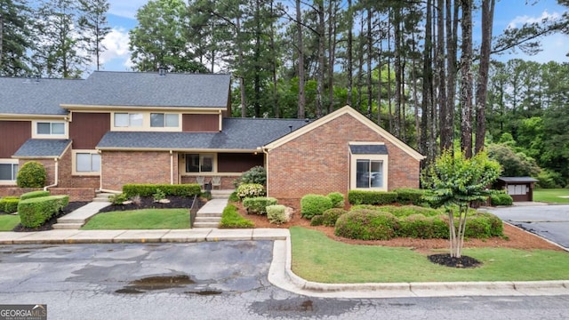 49 Country Ct, Alpharetta, GA 30005 - view of front of property with brick siding, a front yard, and roof with shingles
