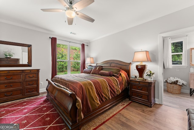 3521 Phoenix Cove Dr, Gainesville, GA 30506 - bedroom with ornamental molding, wood finished floors, baseboards, and ceiling fan