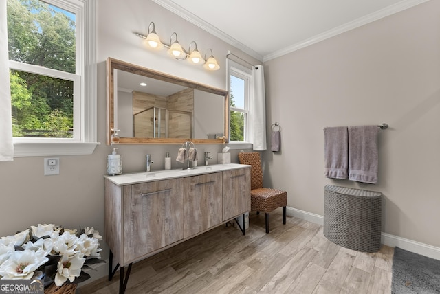 3521 Phoenix Cove Dr, Gainesville, GA 30506 - full bath with a stall shower, baseboards, double vanity, ornamental molding, and wood finished floors